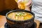 Hot curry ramen in bowl with noodles, meat, and vegetables on food table, popular foods