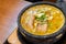 Hot curry ramen in bowl with noodles, meat, and vegetables on food table, popular foods