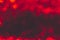 Hot and dark defocused red lights for Valentine`s day background