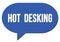 HOT  DESKING text written in a blue speech bubble