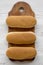 Hot dog buns on wooden board on white wooden background, top view. Flat lay, from above, overhead