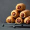 Hot dogs snack on gray background, close up. Pyramid of freshly baked sausage in puff pastry. Food concept. Copy space