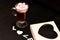 hot drink in a glass cup with pink marshmallows