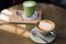 Hot drinks with latte coffee matcha green tea on wooden table