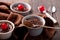 Hot festive French dessert. Chocolate pudding in Ceramic Bakeware with cheery. top view