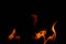 Hot flames on a black background. Beautiful flame of fire in the dark. Abstract of burning flames and smoke