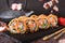 Hot fried Sushi Roll with salmon, shrimp, onion, avocado and cheese