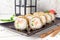 Hot fried Sushi Roll with shrimp, cucumber and cheese philadelphia. Sushi menu.