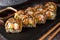 Hot fried Sushi Roll with shrimp, cucumber and unagi sauce.