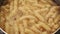 Hot fusilli pasta with rising steam close-up. Food preparation