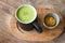 Hot Greentea matcha latte wood background