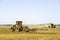 Hot heat summer sun ploughing fields in Kwazulu Natal South Africa, dusty movement blur, tractors, machinery