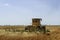 Hot heat summer sun ploughing fields in Kwazulu Natal South Africa, dusty movement blur, tractors, machinery