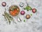 Hot herbal tea with mint, cumin and fresh appetizing macaroons, on white rustic background, top view, close up