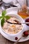 Hot homemade milk oatmeal with natural vanilla and