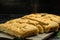 Hot Italian bread traditional pieces of focaccia. Traditional Italian Focaccia with rosemary. Food recipe background. Close up