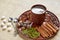 Hot masala tea with various spices on the brown plate: cinnamon, nutmeg, cardamom, anise stars. Aromatic coffee