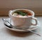 Hot meat Russian traditional tomato soup saltwort Solyanka on white bowl on natural linen background