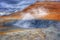 Hot Mud Pots and blue lake in the Geothermal Area Hverir, Iceland