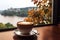 a hot mug of coffee overlooking the autumn landscape outside the window. ai generative