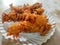 Hot onion bhajjiya bhajiya Indian fast food street food with green pudina chutney on paper plate ready to eat yummy tastey food