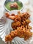 Hot onion bhajjiya bhajiya Indian fast food street food with green pudina chutney on paper plate ready to eat yummy tastey food