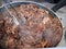 Hot pan with veal shank and steam. Cooking Beef veal shank, close up photo