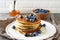Hot pancakes in stack with berries