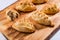 Hot pasties from butter enriched puff pastry filled with minced