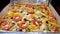 Hot Pizza with Hot Cheese, Mussels and Olives in paper board box