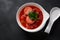 Hot red beet Kubbeh soup, a famous middle eastern dumplings soup dish, served in a bowl.
