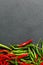 Hot red and green chilli background, top view.