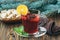 Hot red mulled wine on wooden background decorated blue spruce branches, with christmas spices, orange slice, fresh mint, cloves