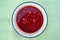 Hot red rustic soup in meat broth from vegetables and beetroot-