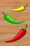 Hot red, yellow and green mexican peppers, on a wooden table background. Vector vertical orientation