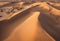 a hot sandy horizon sand dune ripples dry remote desert outdoors dunes isolated scenery arid climate wilderness extreme sunny