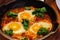 In hot shakshuka tomatoes sweet peppers eggs and herbs