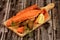 Hot smoked salmon bones on wooden kitchen board