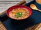 hot and sour soup with green onion served in a bowl isolated on table top view of taiwanese food