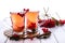 Hot spicy beverage with viburnum in glass cups with fresh viburnum berries and cinnamon sticks, anise stars