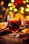 Hot spicy Christmas gluhwein, or mulled red wine with sugar and spices, served with cookies on rustic wood with a