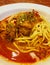 Hot and spicy rendang chicken noodle on the table.