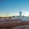 Hot spring at El Tatio Geysers with steaming geysers, hot springs, boiling water all around at sunrise, Chile, South America