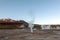 Hot spring at El Tatio Geysers with steaming geysers, hot springs, boiling water all around at sunrise, Chile, South America