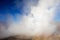 Hot spring at El Tatio Geysers with steaming geysers, hot springs, boiling water all around at sunrise, Chile, South America