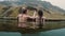 Hot spring geothermal spa in Iceland. Two traveling woman relaxing in hot pool with beautiful landscape on mountain.