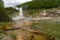 Hot springs and geysers including Blood Geyser along the Artists Paint Pots trail in Yellowstone National Park Wyoming