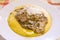 Hot and steaming corn polenta topped with mushroom sauce ready for your meal