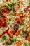 Hot steaming pizza with vegetables, closeup, topview