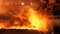 Hot steel being poured to the chute at the steel plant, heavy industry concept. Stock footage. Molten steel production